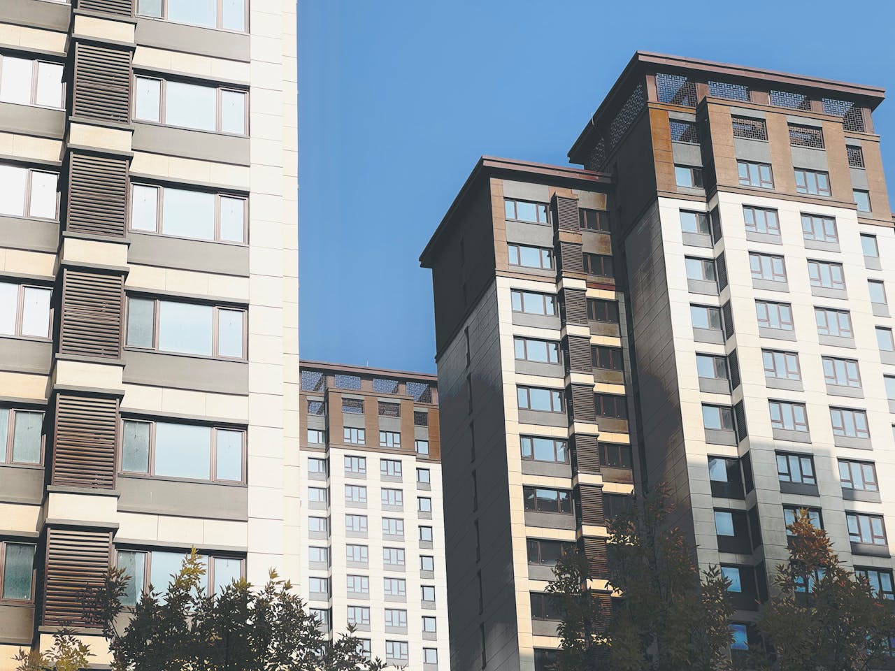 The Art of Drawing Readers In: Your attractive post title goes here Contemporary high-rise residential buildings against a clear blue sky in Tianjin, China.